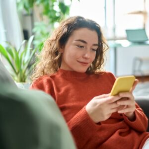 Woman using attraction ticketing software on her phone